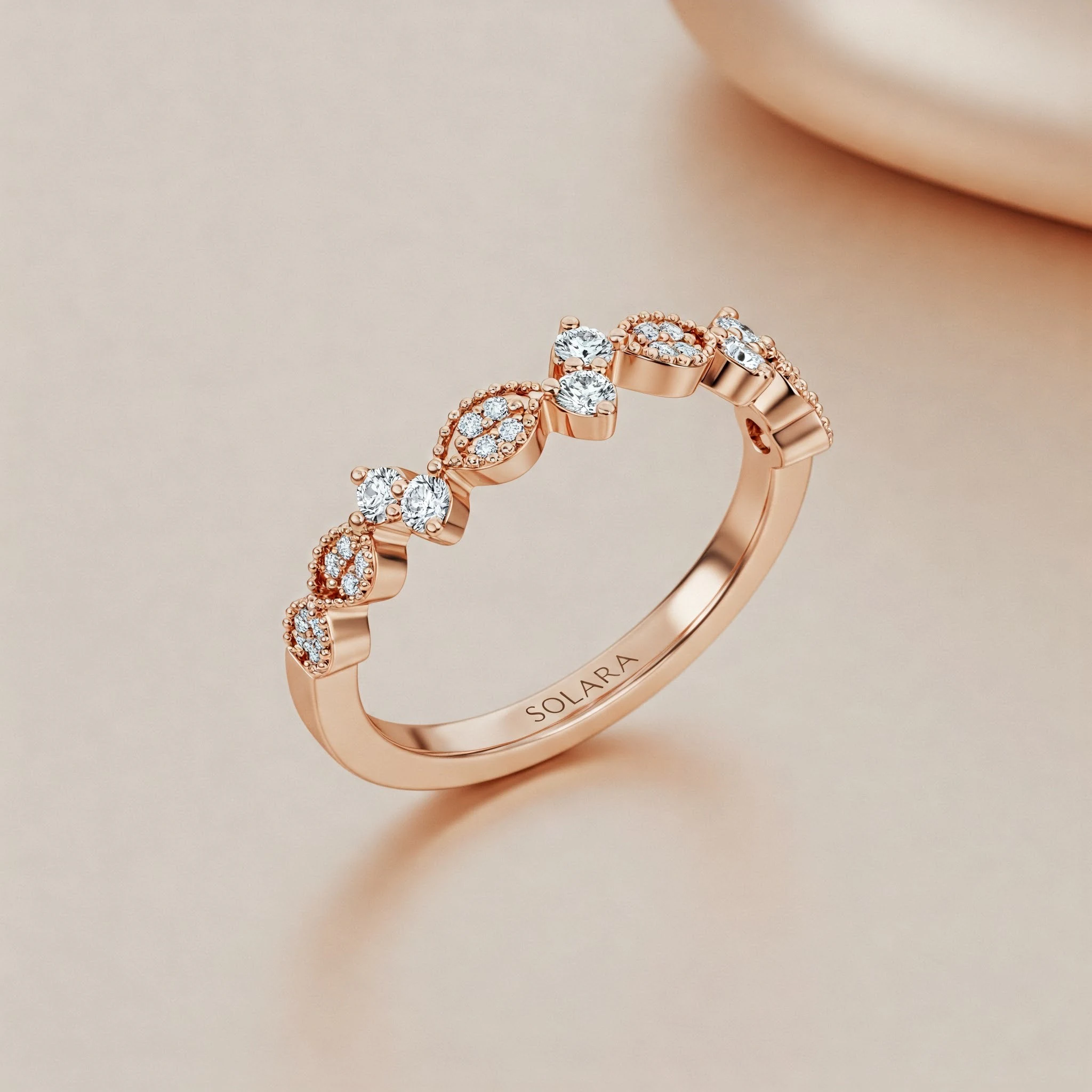 Round wedding band in rose gold, three-quarter view